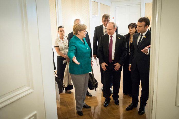 Ангела Меркел, Владимир Путин и Емануел Макрон на срещата на Г20 в Хамбург. Снимка: German Government/Kugler