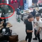 Мъж поставя ръка на гърба на жената